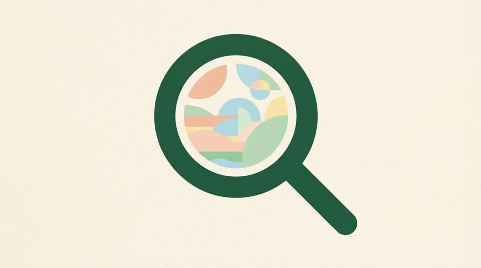 A round magnifying lens shape over a plain cream rectangle.